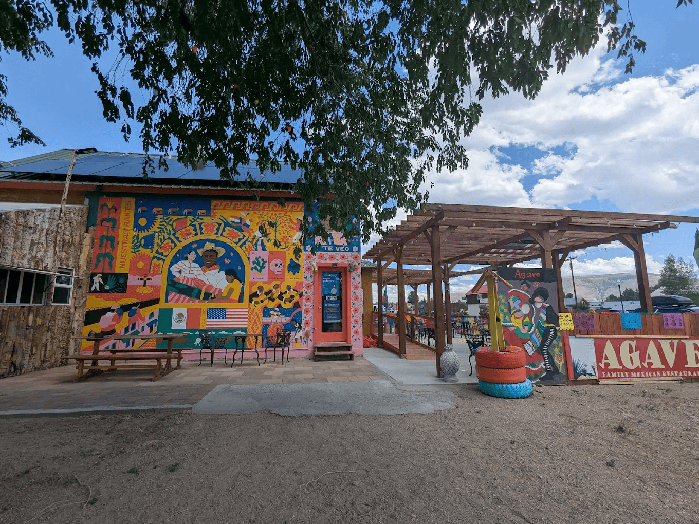 Colorful exterior and outdoor patio of Agave Family Mexican Restaurant in Gunnison, Colorado